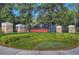 Welcome to Sandhill Place: A beautifully landscaped community entrance with an elegant stone sign at 6030 Sandhill Ridge Dr, Lithia, FL 33547