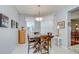 Cozy dining area with a wooden table set, natural light, and stylish decor at 6030 Sandhill Ridge Dr, Lithia, FL 33547