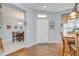 Warm and welcoming foyer with hardwood flooring, a dining area, and neutral paint colors at 6030 Sandhill Ridge Dr, Lithia, FL 33547