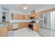 Well-equipped kitchen with stainless steel appliances, tile floors, and plenty of counter space at 6030 Sandhill Ridge Dr, Lithia, FL 33547