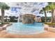 Stunning pool with a captivating rock waterfall feature, creating a luxurious and serene atmosphere at 6030 Sandhill Ridge Dr, Lithia, FL 33547
