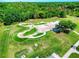 Aerial shot of a modern skate park featuring a variety of ramps, rails, and green spaces at 6030 Sandhill Ridge Dr, Lithia, FL 33547