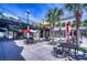 Town Center with outdoor seating, palm trees, and shops in a vibrant community space at 6030 Sandhill Ridge Dr, Lithia, FL 33547