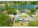 Aerial view of a neighborhood with lush greenery and lake access at 6705 Ranger Dr, Tampa, FL 33615