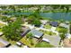 Aerial view of a home nestled in a lush neighborhood, close to a serene lake at 6705 Ranger Dr, Tampa, FL 33615