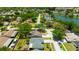 A cozy neighborhood with a blend of houses, mature trees, and access to a tranquil lake at 6705 Ranger Dr, Tampa, FL 33615