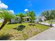 A cozy home with mature trees and manicured landscaping that enhances the curb appeal at 6705 Ranger Dr, Tampa, FL 33615