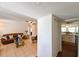 Comfortable living room featuring tile flooring and a leather sofa with blue accents at 6705 Ranger Dr, Tampa, FL 33615