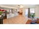 Open floor plan showcasing a kitchen with breakfast bar, living area, and access to the lanai at 6705 Ranger Dr, Tampa, FL 33615