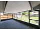 Covered patio area with views of the spacious backyard and surrounding greenery at 6705 Ranger Dr, Tampa, FL 33615