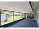 Spacious screened in porch with views of the lush backyard, offering an outdoor relaxation area at 6705 Ranger Dr, Tampa, FL 33615