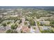 Aerial view of residential area featuring homes, tree coverage, and paved roads at 7111 Oregon Chickadee Rd, Weeki Wachee, FL 34613