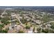 Expansive aerial view of a residential neighborhood with tree-lined streets and well-maintained homes, offering a peaceful setting at 7111 Oregon Chickadee Rd, Weeki Wachee, FL 34613