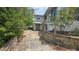 Backyard with stone stairs and lush landscaping leading up to the house at 7111 Oregon Chickadee Rd, Weeki Wachee, FL 34613