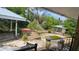Backyard featuring a swimming pool, gazebo, landscaping, and various outdoor structures at 7111 Oregon Chickadee Rd, Weeki Wachee, FL 34613