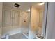 Functional bathroom with shower, toilet, built-in cabinets, and natural light from the window at 7111 Oregon Chickadee Rd, Weeki Wachee, FL 34613