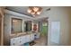 Bathroom with double vanity, mirrors and storage at 7111 Oregon Chickadee Rd, Weeki Wachee, FL 34613
