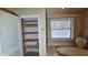 Linen closet next to jetted tub and window at 7111 Oregon Chickadee Rd, Weeki Wachee, FL 34613