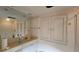 Bathroom with large mirror, built-in vanity and storage, plus a shower and tub combo at 7111 Oregon Chickadee Rd, Weeki Wachee, FL 34613