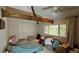 Bedroom featuring a window with blinds, ceiling fan, and closet space at 7111 Oregon Chickadee Rd, Weeki Wachee, FL 34613