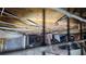 A view of the crawl space under the house, highlighting insulation and utility lines at 7111 Oregon Chickadee Rd, Weeki Wachee, FL 34613