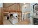 Bright kitchen boasts granite counters, wood beams, island and open floorplan at 7111 Oregon Chickadee Rd, Weeki Wachee, FL 34613