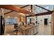 Kitchen island features granite countertops, breakfast bar, and stainless sink at 7111 Oregon Chickadee Rd, Weeki Wachee, FL 34613