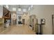 Open living room with high ceilings, a fireplace, and hardwood floors, offering ample space at 7111 Oregon Chickadee Rd, Weeki Wachee, FL 34613
