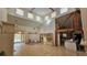 Expansive living room with tall ceilings and multiple windows, offering abundant natural light and space at 7111 Oregon Chickadee Rd, Weeki Wachee, FL 34613