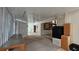 Open floor plan living room with mini fridge at 7111 Oregon Chickadee Rd, Weeki Wachee, FL 34613
