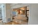 Open living space leads to a sunroom separated by sliding doors and built in storage at 7111 Oregon Chickadee Rd, Weeki Wachee, FL 34613
