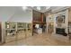 Bright living room with high ceilings, a fireplace, and hardwood floors, a great space for relaxation at 7111 Oregon Chickadee Rd, Weeki Wachee, FL 34613