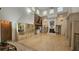 Spacious living room with a fireplace, hardwood floors, and high ceilings, perfect for entertaining at 7111 Oregon Chickadee Rd, Weeki Wachee, FL 34613