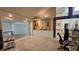 Open living space with built in storage and seamless transition to the carpeted sunroom at 7111 Oregon Chickadee Rd, Weeki Wachee, FL 34613