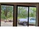 View from the house featuring trees and a vintage car at 7111 Oregon Chickadee Rd, Weeki Wachee, FL 34613