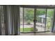 View of the yard and pool area from inside at 7111 Oregon Chickadee Rd, Weeki Wachee, FL 34613