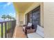 Relax on this cozy balcony with comfortable seating and serene views of the water at 7520 Sunshine Skyway S Ln # 113, St Petersburg, FL 33711