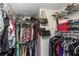 Organized walk-in closet with ample storage space, shelving, and hanging rods for clothing and accessories at 7520 Sunshine Skyway S Ln # 113, St Petersburg, FL 33711