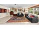 Relaxing living room features a decorative rug and large window views at 8083 Bayhaven Dr, Seminole, FL 33776