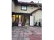 Enclosed back porch with a door leading to a patio, with ample light and neutral walls at 8105 Sheldon Shores Dr, Tampa, FL 33615