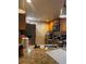 Kitchen featuring wood cabinetry, a granite countertop, and stainless steel appliances at 8105 Sheldon Shores Dr, Tampa, FL 33615