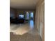 Open-concept living area featuring tile flooring and access to the outdoor space at 8105 Sheldon Shores Dr, Tampa, FL 33615