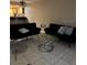 Comfortable living room with tile floors, modern sofas, and stylish coffee table at 8105 Sheldon Shores Dr, Tampa, FL 33615
