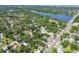 Aerial view capturing the tranquil lake and the surrounding neighborhoods, creating a picturesque and inviting setting at 905 8Th Sw Ave, Largo, FL 33770