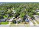 Aerial showcases neighborhood, with mature trees, sidewalks, and the charming home's location at 905 8Th Sw Ave, Largo, FL 33770