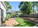 Backyard oasis featuring a wooden deck, lush green lawn, and RV parking, offering the perfect outdoor relaxation space at 905 8Th Sw Ave, Largo, FL 33770