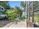 Private backyard features a lush lawn, RV parking, tropical landscaping, and comfortable seating at 905 8Th Sw Ave, Largo, FL 33770