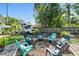 Landscaped backyard featuring RV parking, a fire pit with seating, and lush greenery for relaxation and enjoyment at 905 8Th Sw Ave, Largo, FL 33770