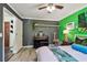 Bright bedroom showcasing a keyboard, shelving, doorway and decorative accents at 905 8Th Sw Ave, Largo, FL 33770
