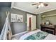 Cozy bedroom featuring a keyboard, shelving, doorway, and playful decor at 905 8Th Sw Ave, Largo, FL 33770